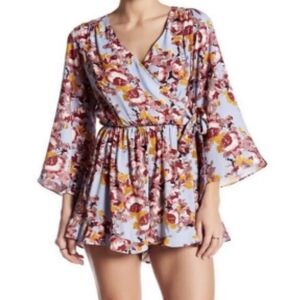 ASTR The Label Blue Floral Side Wrap Romper size XS with Pockets Boho Chic